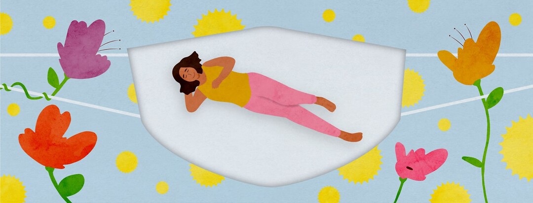a woman laying in the cut out of a mask that is keeping the pollen away