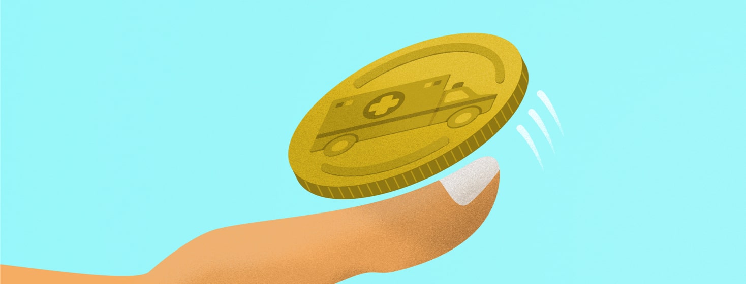 someone flipping a coin with an ambulance on it