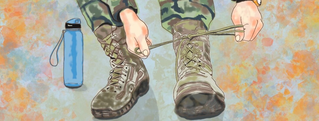 military soldier tying up a boot with an inhaler and water bottle next to them