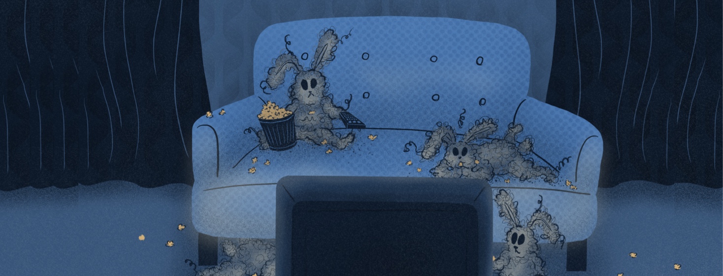 Dust bunnies messily eating popcorn and watching TV in a hotel room