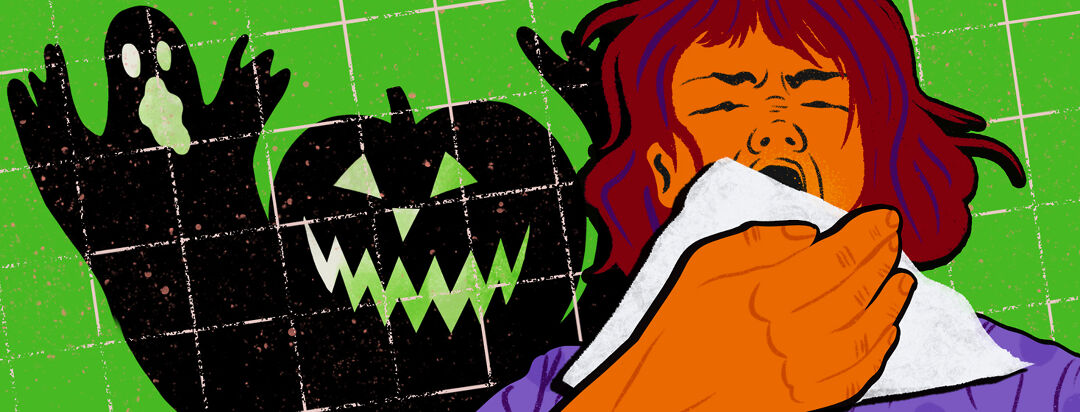 A woman forcefully coughs into a tissue with a looming shadow in the shape of a jack-o-lantern and spooky ghost behind her.